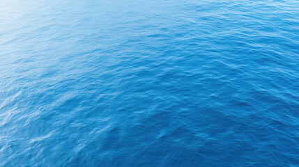 Fototapeta premium Calm ocean surface with gentle waves reflecting sunlight, creating serene atmosphere