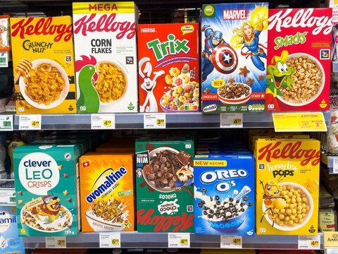 Colorful variety of popular breakfast cereals on supermarket shelf display