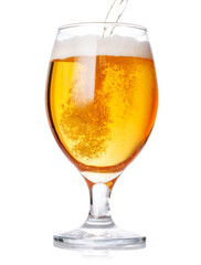 A glass of beer with a golden hue and frothy head, isolated on a clean white background