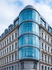 Curved glass facade of a striking modern residential building in a European city - glass apartment contemporary real stylish