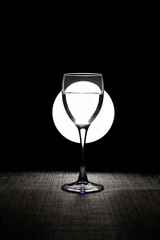 Composition with a glass with a water