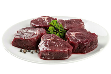 Freshly cut premium beef steaks arranged on a white plate with herbs and whole peppercorns isolated on transparent background