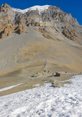 Himalayas, Nepal - The famous hiking on the roof of the world called Annapurna Circuit in the Himalaya range mountain, with little village, buddhist stupa and mountains of 8000 meters.
