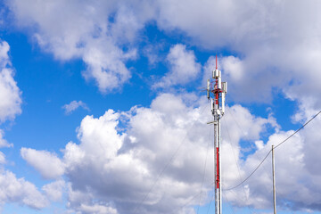 cell phone tower against blue sky