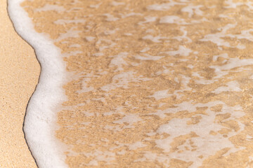 Natural beauty of the shoreline with gentle waves.