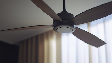 Electrician installing a ceiling fan in a living room. Featuring electrical installation