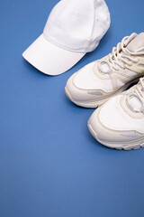 white cap with light sneakers on background