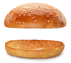 Two parts of a burger bun, covered with sesame on a white background. The file contains clipping paths.