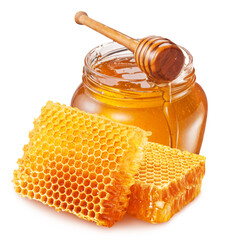 Natural organic honey in glass jar, honey dipper and honeycombs are in. File contains clipping path.