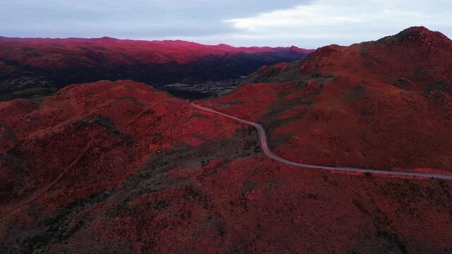 Drone shot druing sunrise over hills in argentina
