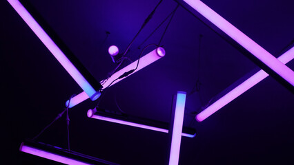 Glowing Neon LED Tubes with Pink and Purple Lighting in a Dark Modern Interior