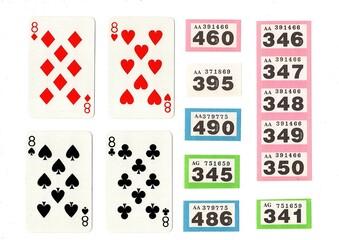 Vintage playing cards and raffle tickets isolated on a white background.