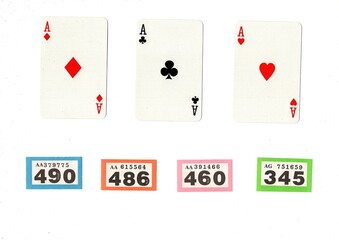 Vintage playing cards and raffle tickets isolated on a white background.