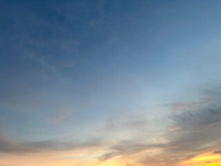Beautiful sky with natural gradations. Thick clouds in the dusk sky on a winter night. Image of a cloudy sky in the afternoon. View of the night sky with golden light from the evening sun