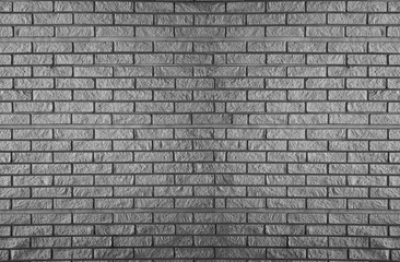 monochrome grey brick wall with repeating pattern. White brick wall texture background for stone tile block painted in grey light color wallpaper modern interior and exterior and backdrop design