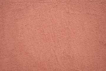 Light pink red rose plaster Wall Background Texture. Beautiful Decorative Stucco with Abstract pattern. Design Interior. Artistic wallpaper with empty Copy Space pattern.