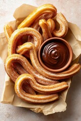 Churros dusted with cinnamon sugar arranged in a spiral on parchment paper, served with a small bowl of thick, rich chocolate dipping sauce.