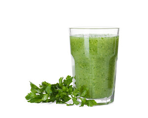 Healthy parsley smoothie in glass and leaves isolated on white