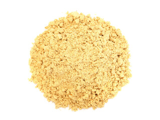 Pile of dry ginger powder isolated on white, top view