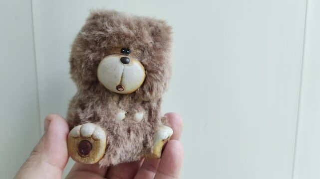 small toy bear. teddy bear figurine.
