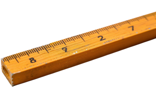 A close-up view of a well-used yellow wooden ruler on a bright white surface isolated on transparent background