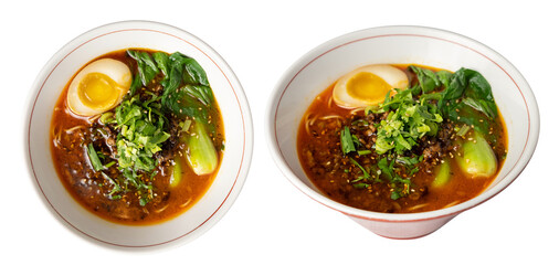 Spicy ramen topped with soft-boiled egg, minced pork, bok choy, fresh cilantro, and sesame seeds, served in a white bowl with a rich red broth. 