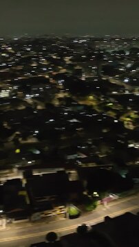 Itaquera neighborhood in S&atilde;o Paulo at night. Aerial view. Vertical video.