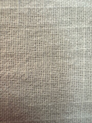 Fototapeta premium A close up shot of a white textured fabric, showing a detailed surface and woven pattern