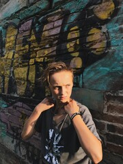 Teen Boy in Urban Street with Graffiti Background