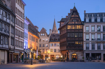 Fototapeta premium Exploring the Charming Timber-Framed Architecture of Strasbourg's Old Town at Dusk