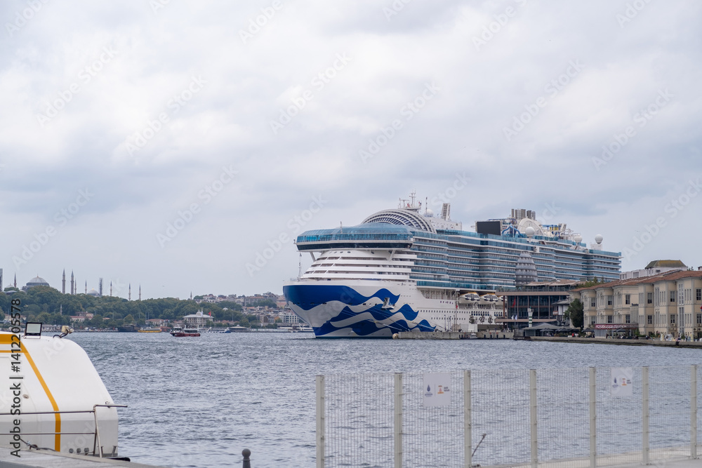 Aufkleber cruise ship docked in the bosphorus with istanbul skyline in the background during an overcast day