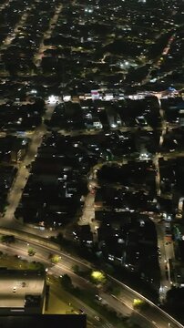 Itaquera neighborhood in S&atilde;o Paulo at night. Aerial view. Vertical video.