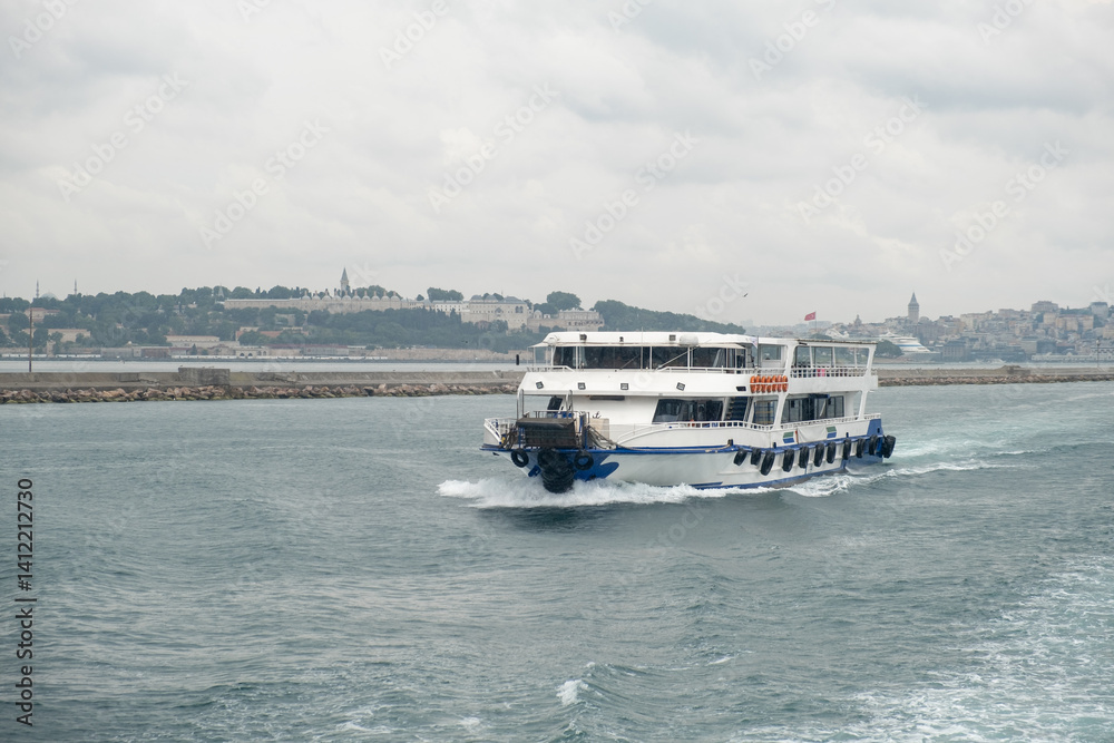 Aufkleber nautical journey across the bosphorus with a ferry navigating the waters under overcast skies