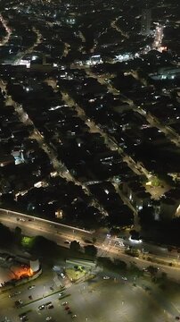Itaquera neighborhood in S&atilde;o Paulo at night. Aerial view. Vertical video.