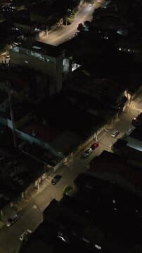 Itaquera neighborhood in S&atilde;o Paulo at night. Aerial view. Vertical video.