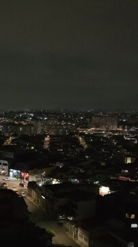 Itaquera neighborhood in S&atilde;o Paulo at night. Aerial view. Vertical video.