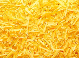 Fototapeta premium Shredded cheese, with the texture of yellow, shredded cheese