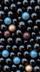 Black spheres with blue, brown, and gold accents in a reflective pattern