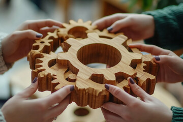 Wooden gears teamwork collaboration connection hands puzzle