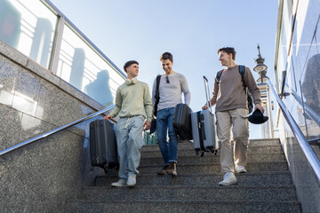 A group of friends using the subway while traveling through a European city