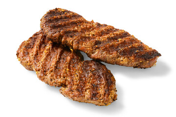spicy tenderized beef cutlets on white background