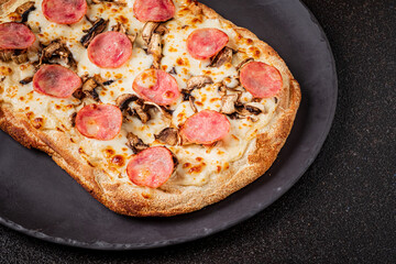 Enjoy a unique flatbread topped with savory sausage, melted cheese, and mushrooms to share