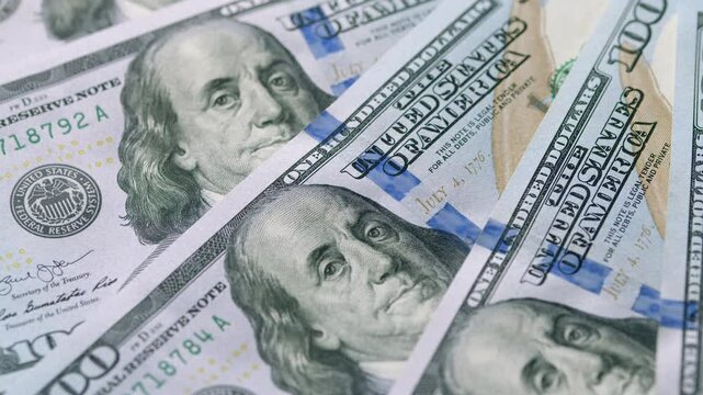 A Beautiful Variety of 100 Dollar Bills Laid Out for Display or Collection Purposes