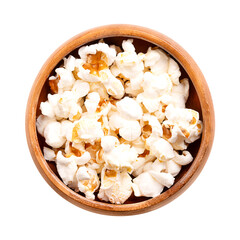 Popcorn, popped corn in a wooden bowl. Seeds of Zea mays variety everta, expanded and puffed up, after heated. Snack food, also called popcorns and pop-corn, with mushroom- and butterfly-shaped forms.
