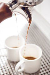 Brewing Fresh Espresso Into Two White Cups From Coffee Machine