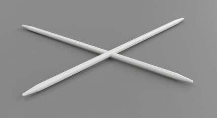Smooth White Knitting Needle on Gray Surface