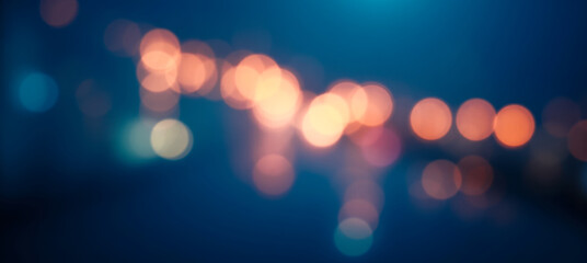 Cool abstract bokeh lights in deep blue background with warm golden circles perfect for dreamy...