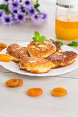 Homemade cheese pancakes with a delicate texture and aromatic dried apricots