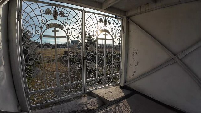 beautiful forged gates. Beautiful view of an old city architecture with stone stairs, columns, stucco moulding, plaster of paris. Grandiose forged gates, church gates.