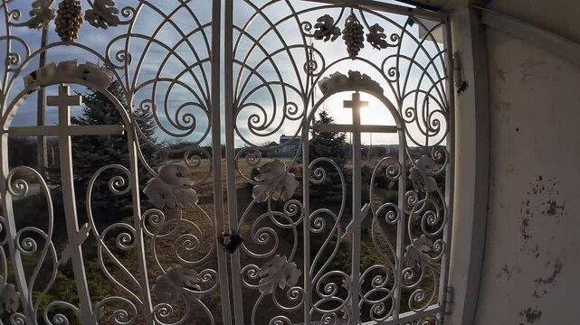 beautiful forged gates. Beautiful view of an old city architecture with stone stairs, columns, stucco moulding, plaster of paris. Grandiose forged gates, church gates.